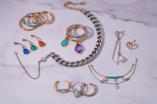 Fashion jewelry trends 2026 featuring layered cartilage hoops, colorful gemstone nose rings, stacked belly rings, chunky chains, and mixed metal body jewelry